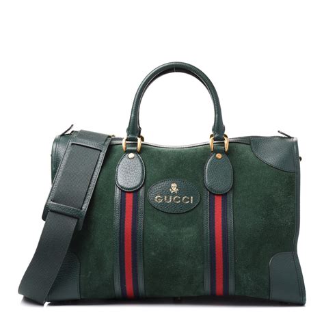 gucci suede duffle bag.